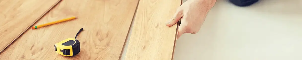 A professional installing wood flooring in Ann Arbor, MI