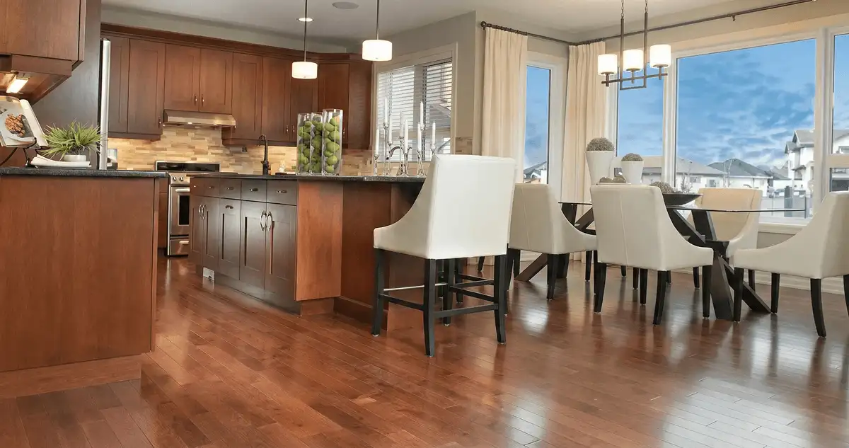 A modern kitchen with professionally installed wood flooring in Ann Arbor, MI