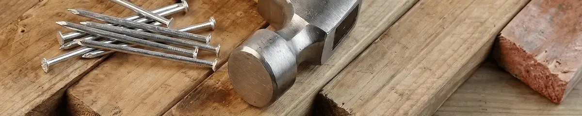Hammer and nails on hardwood flooring boards in Ann Arbor, MI