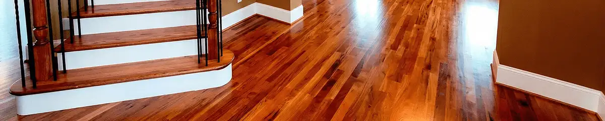 Base floor of a staircase with professionally restored wood flooring in Ann Arbor MI