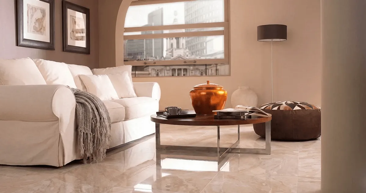 Modern living room with professionally installed marble flooring, a beige sofa, coffee table in Ann Arbor, MI