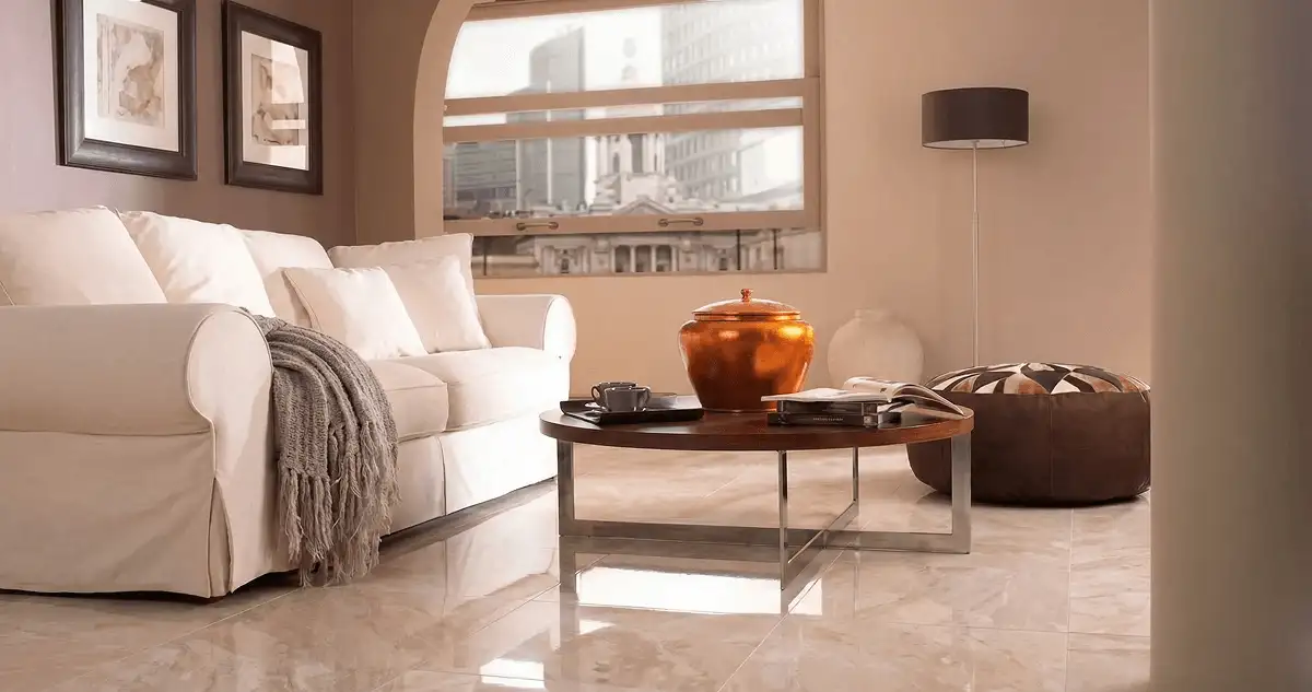 Modern living room with professionally installed marble flooring, a beige sofa, coffee table in Ann Arbor, MI