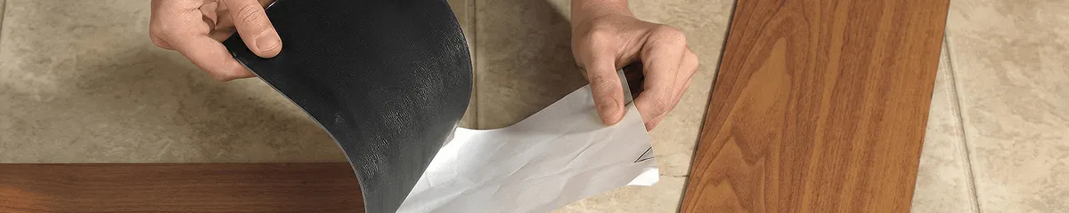 A professional installing vinyl flooring in Ann Arbor, MI