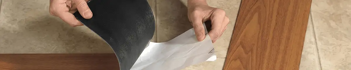 A professional installing vinyl flooring in Ann Arbor, MI