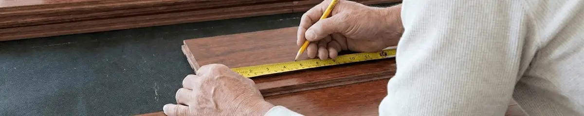 A professional installing wood flooring in Ann Arbor, MI